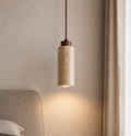 Travertine stone cylinder pendant light in bedroom setting