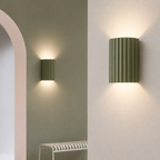 Fluted Resin Wall Light in Sage Green styled in a hallway