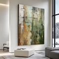 Large format abstract textured painting in sage green, taupe, ivory and gold tones displayed on a white wall in a modern luxury living room