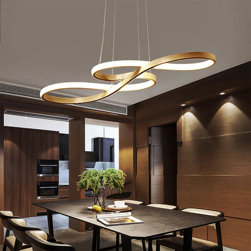 Gold music note LED pendant chandelier hanging above a dark wood dining table in a modern luxury dining room