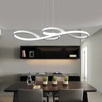 White music note LED pendant chandelier above a dining table in a contemporary grey and black interior