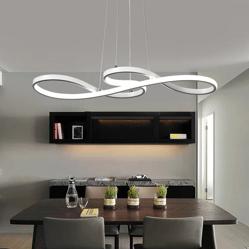 White music note LED pendant chandelier above a dining table in a contemporary grey and black interior