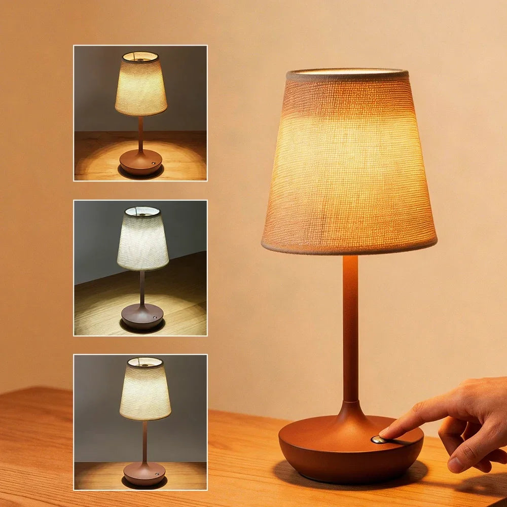 Wireless LED fabric table lamp in brown finish on a wooden desk showing three brightness levels and touch control base