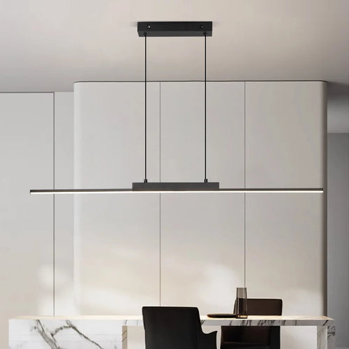 Linear LED pendant light over a white dining table