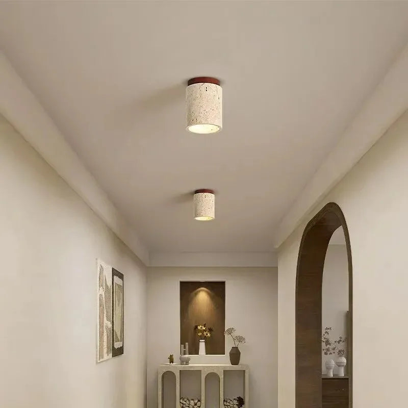 Travertine stone and wood flush mount ceiling lights installed in a minimalist Japanese-style hallway corridor