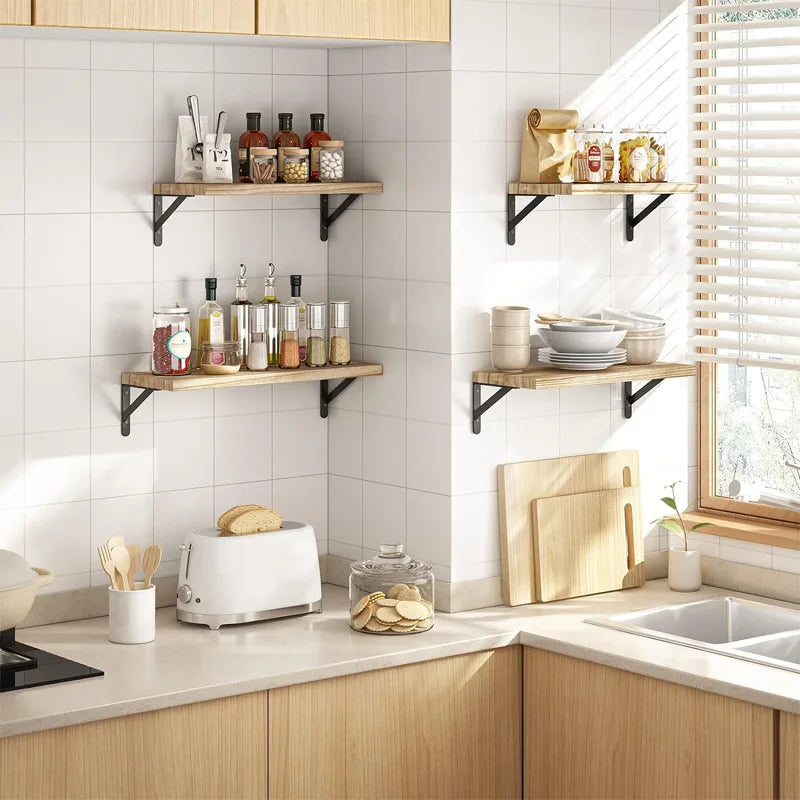 Rustic wood floating shelf with black metal bracket and text Decorate Your Empty Walls in a cozy living room with couple on sofa