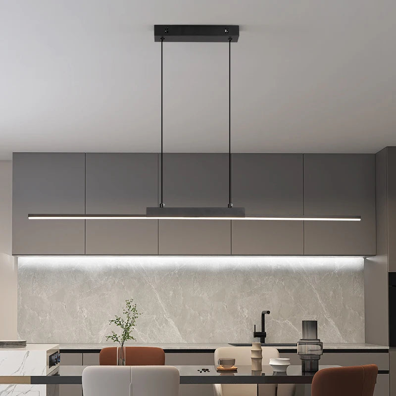 Linear LED pendant light over a modern kitchen island