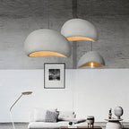 Wabi Sabi hand-knitted pendant lights in grey hanging in a minimalist living room
