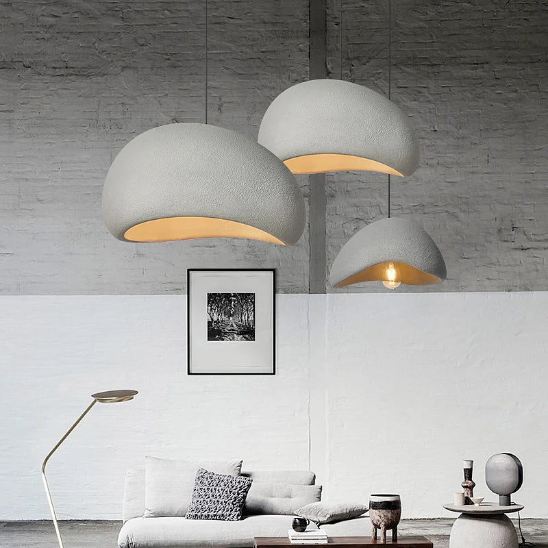 Wabi Sabi hand-knitted pendant lights in grey hanging in a minimalist living room