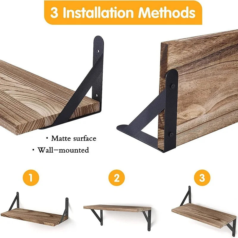 Rustic wood floating shelves with black brackets mounted in a bright kitchen displaying spices, dishes and pantry items