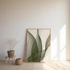 Large minimalist green leaf line art print leaning against a white wall in a minimalist Japandi space