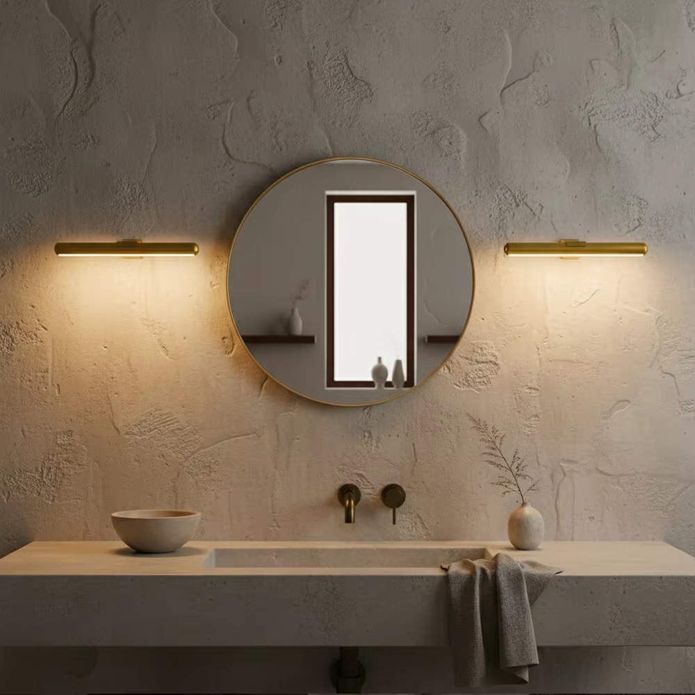 Two wireless LED picture lights flanking a round mirror in a modern bathroom